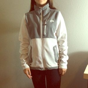 white north face zip up jacket